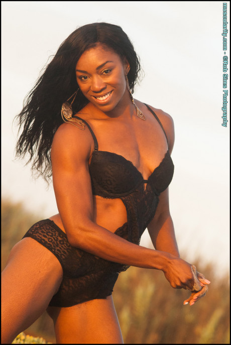 Black bodybuilder Arian Elizabeth models ebony swimwear in outdoor settings - #645584