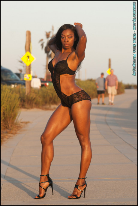 Black bodybuilder Arian Elizabeth models ebony swimwear in outdoor settings - #645588