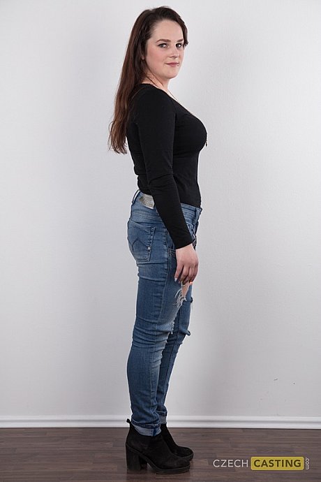 Chubby girl girl girl Michaela stands fully clothed before getting behind undressed