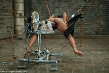 Ebony slut Erica Sommers mounts a machine dildo doggystyle in a hot BDSM scene - #1282640