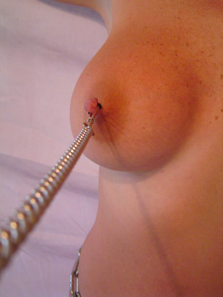 Busty mature chick gets her nipples tugged & sits on a dildo in chain bondage - #1487805