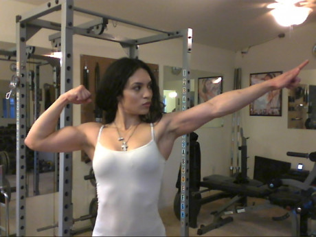 Sweet babe with amazing abs Tia flaunts her biceps at a home gym - #428239