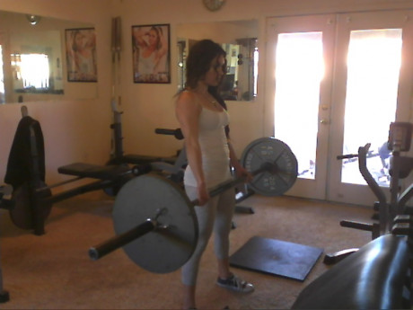 Sweet babe with amazing abs Tia flaunts her biceps at a home gym - #428245