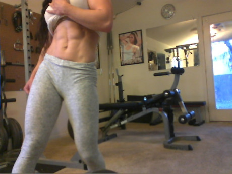 Sweet babe with amazing abs Tia flaunts her biceps at a home gym - #428251