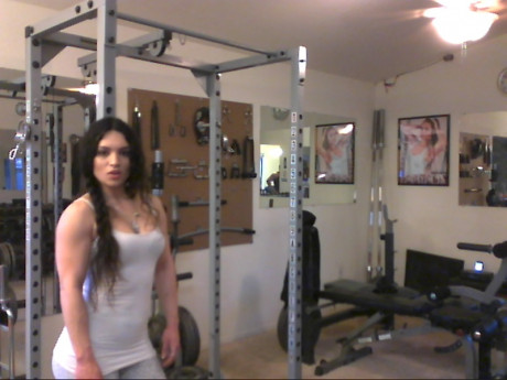 Sweet babe with amazing abs Tia flaunts her biceps at a home gym - #428252