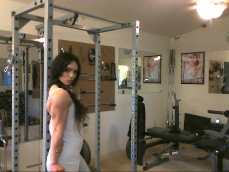 Sweet babe with amazing abs Tia flaunts her biceps at a home gym - #428253