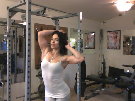 Sweet babe with amazing abs Tia flaunts her biceps at a home gym - #428256