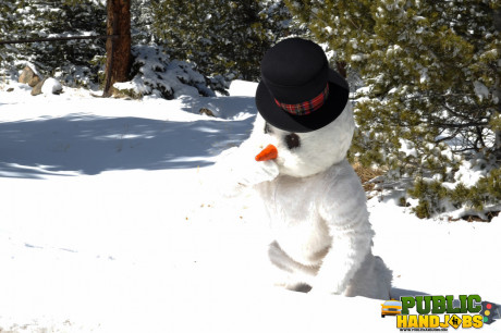 Dirty redhead Brandi de Lafey gives a snowman a CFNM handjob in the woods - #663433