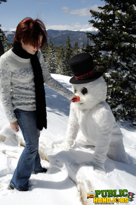 Dirty redhead Brandi de Lafey gives a snowman a CFNM handjob in the woods - #663436
