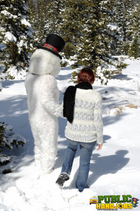 Dirty redhead Brandi de Lafey gives a snowman a CFNM handjob in the woods - #663437