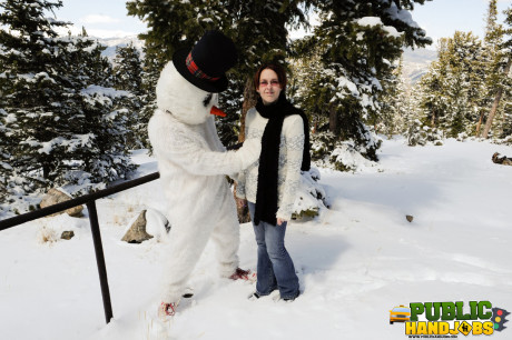 Dirty redhead Brandi de Lafey gives a snowman a CFNM handjob in the woods - #663438