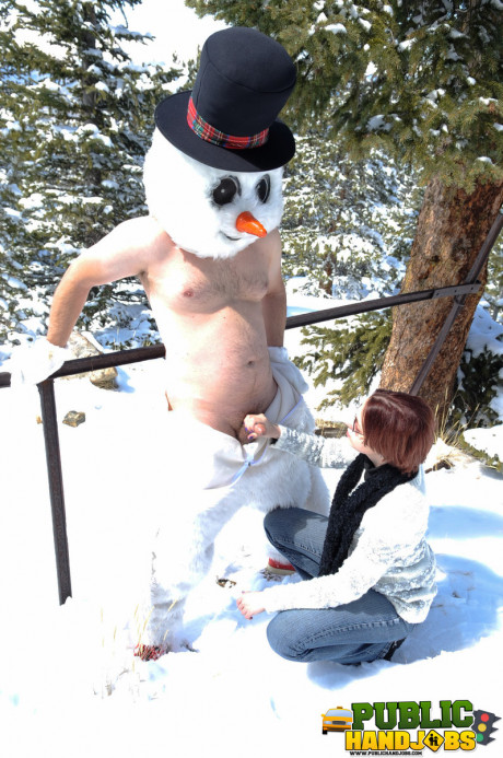 Dirty redhead Brandi de Lafey gives a snowman a CFNM handjob in the woods - #663444