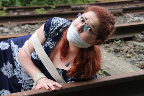 Fully clothed ginger is left gagged and bound on railway tracks - #318948