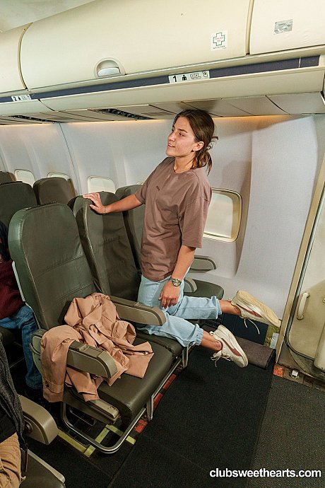 Naughty teenie Sara Heat strips nude in a plane & spreads her shaved vagina - Image 1 of 20  in Pussy category   featuring Sara Heat 