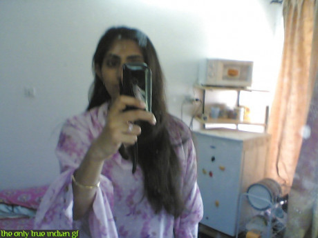 Indian girl gf woman takes selfies in a mirror while wearing a see-through tank top - #488432