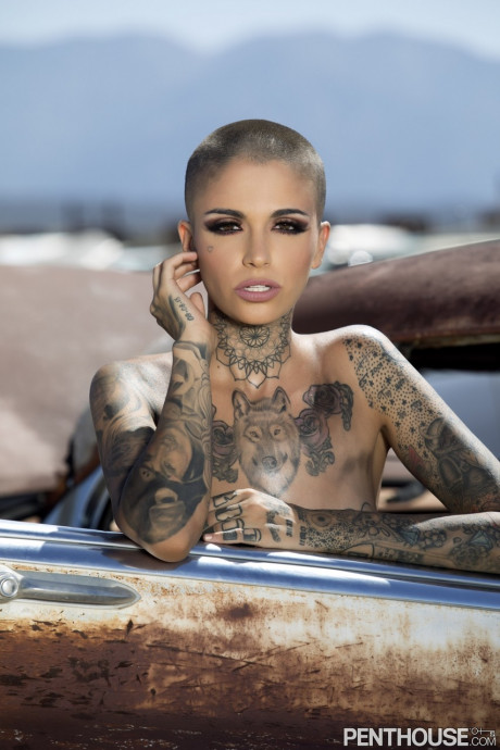 Bald inked babe Leigh Raven flaunts her small breasts and poses naked outdoors - #305932