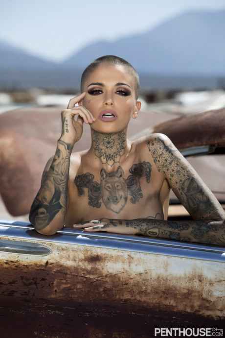 Bald inked babe Leigh Raven flaunts her small breasts and poses naked outdoors - #305934