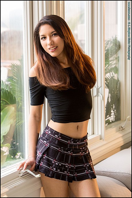 Oriental teenie Melody Wylde gets totally nude in a tempting manner