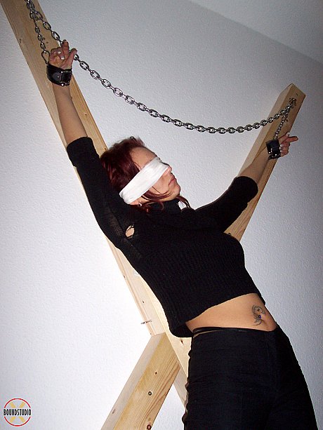 Blindfolded red hair Lilu Natilova is chained to a St Andrew's Cross - Image 4 of 16  in Bondage category   featuring Lilu Natilova 