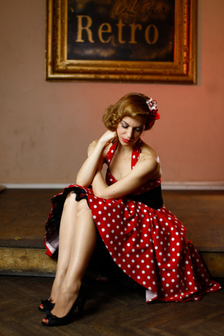 Glamorous pinup lady girl woman posing in her gorgeous dress & heels in a solo