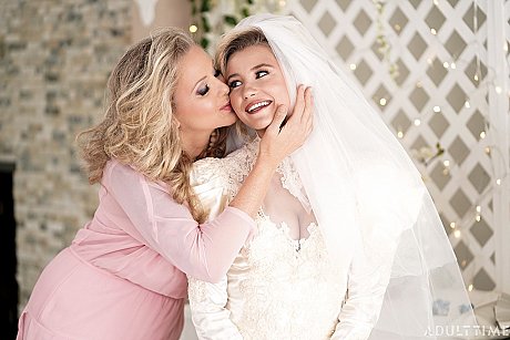 Carolina Sweets is affixed with a garter before a lesbian wedding to Julia Ann - Image 8 of 15  in Lesbian category   featuring Carolina Sweets, Julia Ann 
