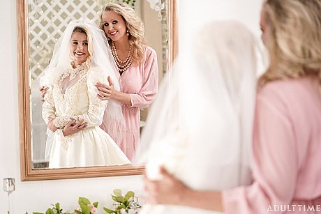 Carolina Sweets is affixed with a garter before a lesbian wedding to Julia Ann - Image 13 of 15  in Lesbian category   featuring Carolina Sweets, Julia Ann 