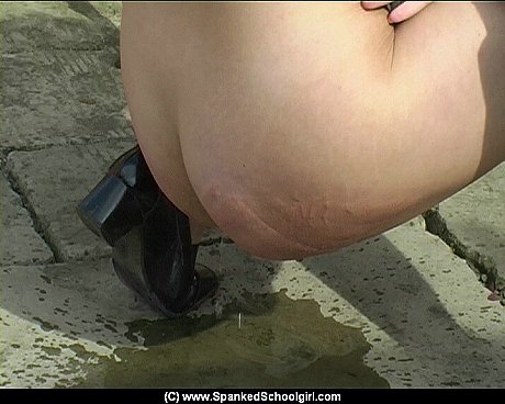 Schoolgirl receives a brutal caning after peeing on patio stones - Image 3 of 12  in Outdoor category  