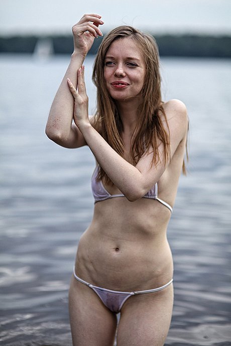 Skinny brunette young posing in her tiny white bikini in the sea water - Image 11 of 17  in Teen category   featuring Gloria 