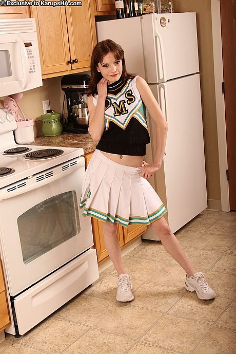 Redheaded cheerleader Hunter stripping and masturbating in the cuisine - Gallery #39942