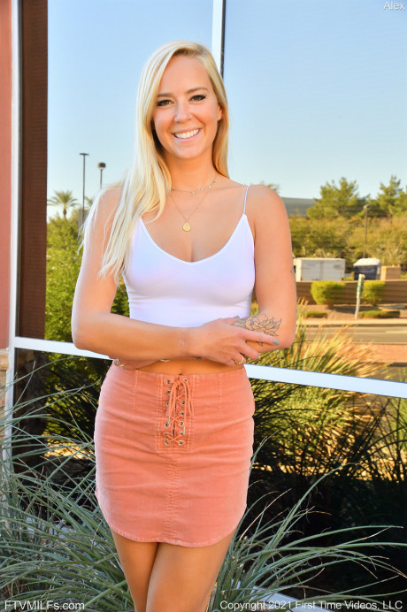 Leggy blonde Alex doffs a miniskirt before showing her pink pussy outdoors - #45142