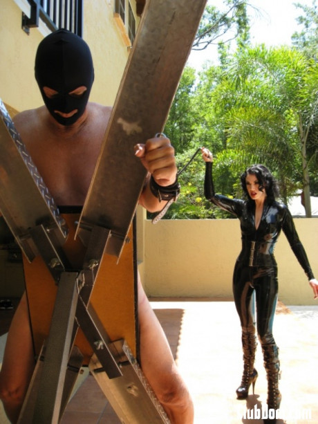 Femdom in hot latex outfit Jean Bardot whipping her tied up slave's back - #1127056