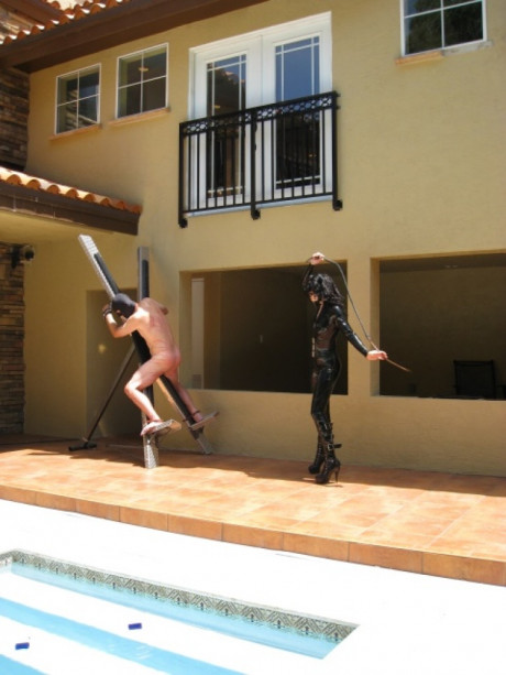Femdom in hot latex outfit Jean Bardot whipping her tied up slave's back - #1127057