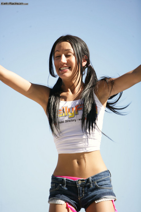 Adorable young model Amia Miley posing in a bikini outfit outdoors - #540301