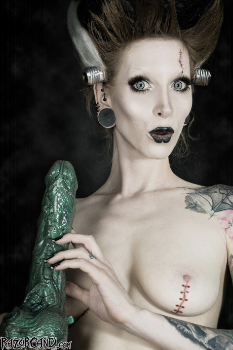 Tattoo model Razor Candi sucks on a monstrous dildo in Bride of Frankenstein attire - #900179