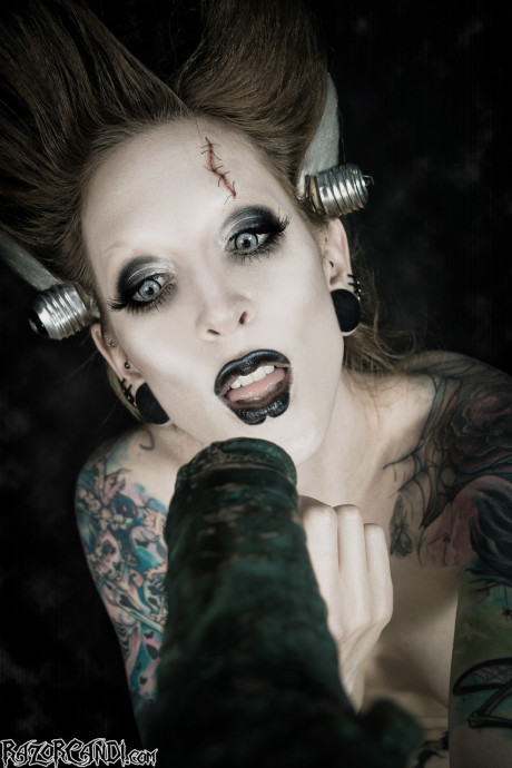 Tattoo model Razor Candi sucks on a monstrous dildo in Bride of Frankenstein attire - #900180