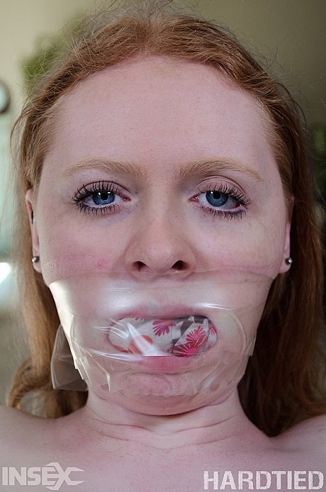 Tied up female Ruby Red takes a piss after losing control of her bladder - Image 3 of 14  in Pussy category   featuring Ruby Red 