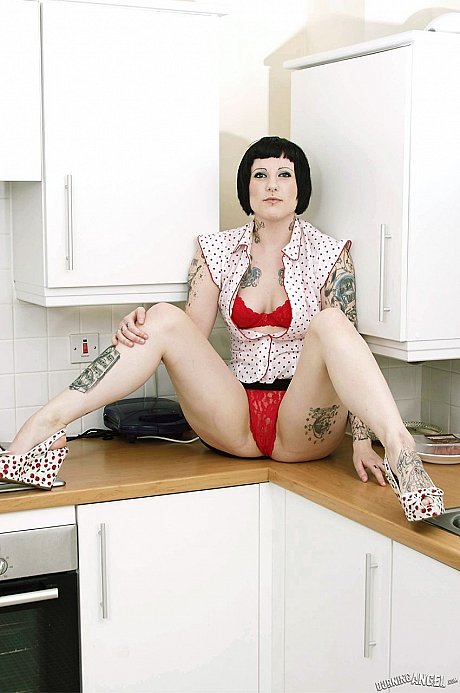 Tall inked goth peels in the kitchenette to flaunt her tats & vagina on the counter - Image 4 of 17  in Pussy category  