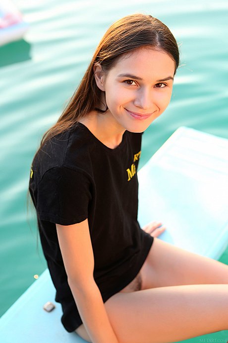 Adorable young Leona Mia strips and fondles her tiny boobs in the pool - Image 2 of 20  in Ass category   featuring Leona Mia 