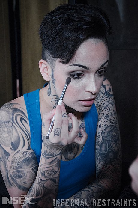 Tattooed female Leigh Raven has her moth forced open during BDSM play