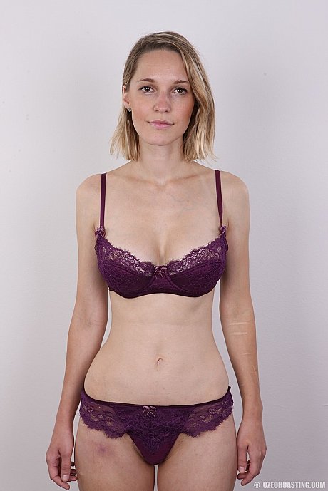 European female Tereza wears no expression while undressing for rent money - Image 6 of 20  in Close Up category   featuring Tereza 