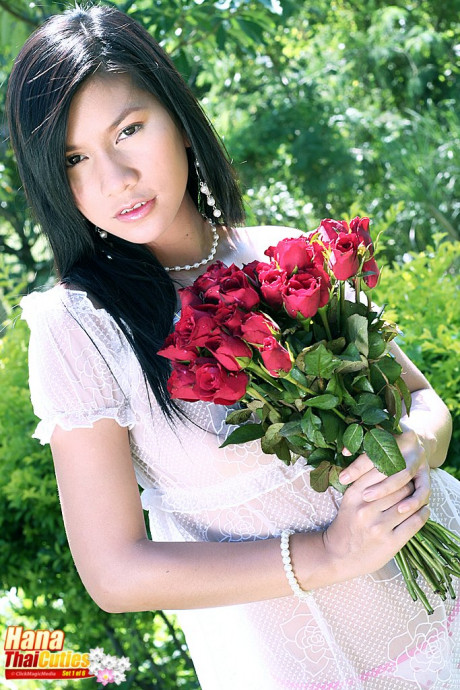 Dark haired Thai chick girlfriend woman Hana holds flowers while showing her boobies and twat - #370335