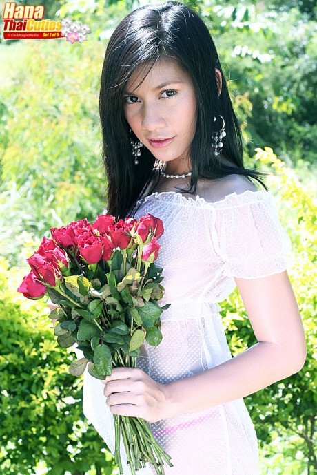 Dark haired Thai chick girlfriend woman Hana holds flowers while showing her boobies and twat - #370339
