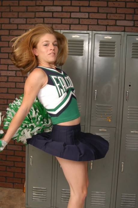 Young cheerleader gets totally undressed in front of change room lockers - #133477