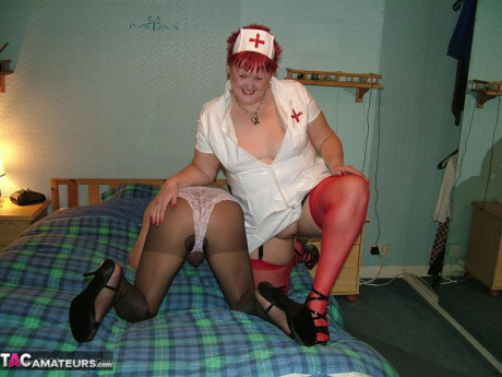 Older nurse with red hair Valgasmic Exposed indulges in foreplay with a sissy
