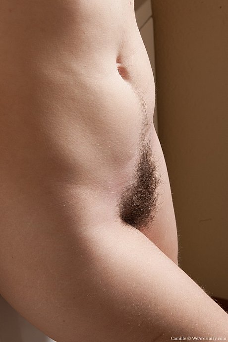 Camille strips and shows her furry crotch while posing on a washing machine - Image 17 of 20  in Close Up category   featuring Camille 