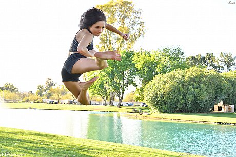 Teenage hottie in cute outfit Zoe doing exercise outdoors by the water - Image 7 of 20  in Model category   featuring Zoe Bloom 