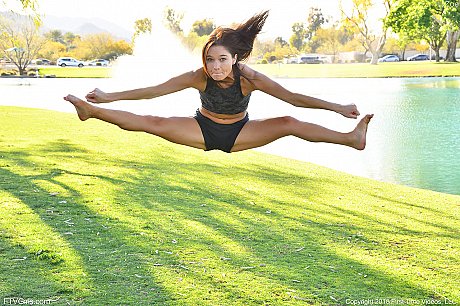 Teenage hottie in cute outfit Zoe doing exercise outdoors by the water - Image 9 of 20  in Model category   featuring Zoe Bloom 