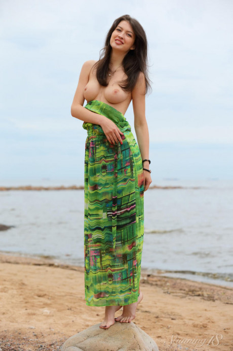 Slender teen Ganna A drops her long dress to air perfect titties on the beach - #1170062