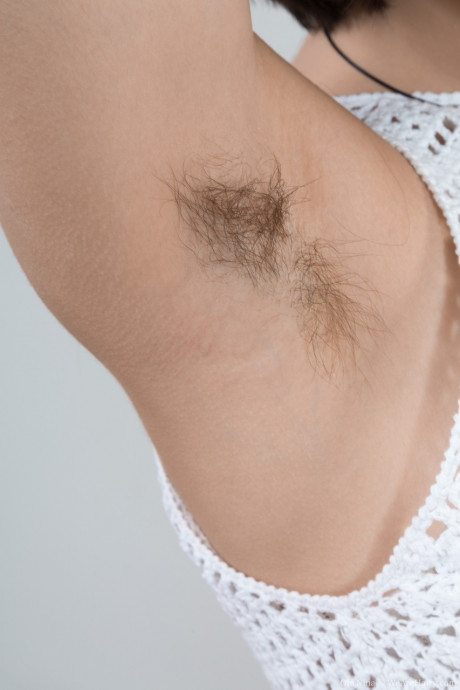 Ole Nina shows silky pits & spreads hairy snatch for attractive fingering on camera