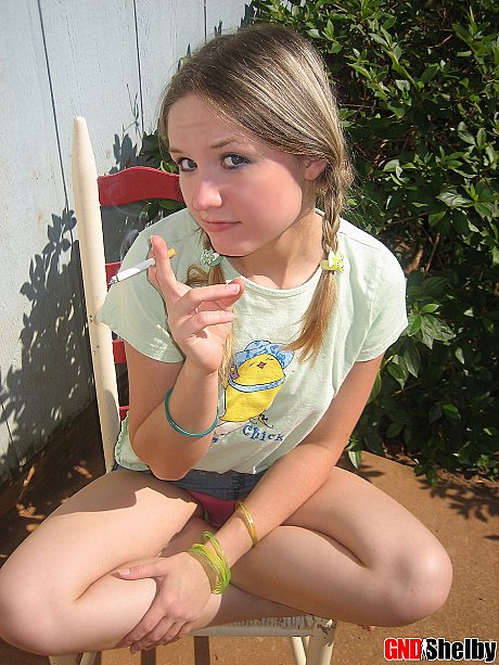 Young teenie bitch gf woman smokes a cigarette while exposing her melons and pussy - Image 5 of 12  in Outdoor category  